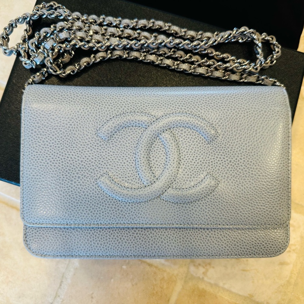 CHANEL
Light Blue Caviar Leather Timeless WOC Clutch Bag